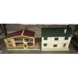 A 1970s oak leaf dolls house and another dolls house (no furniture)