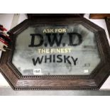 An oak framed mirror advertising D.W.