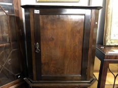 A mahogany corner cupboard