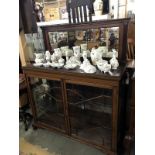 A 20th Century sideboard featuring bevel edge mirror back and glazed cabinet