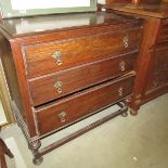 A mid 20th century oak 3 drawer chest.