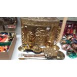 A brass log bin with other brassware including candlesticks, trivet,