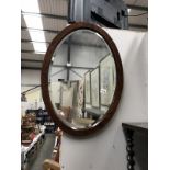 An oak oval bevel edged mirror