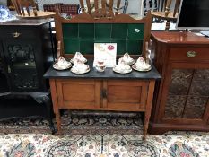 A marble top satin walnut washstand with green tile back