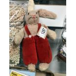 A Norah Wellings bunny rabbit doll in red dungarees