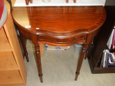 An inlaid mahogany hall table