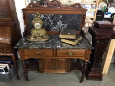 An ornately carved marble topped wash stand - rear leg trolley wheel missing A/F