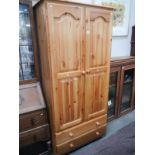 A modern solid pine wardrobe with 2 drawers