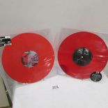 2 red vinyl records.