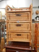 A cane/wicker bathroom chest of drawers