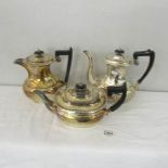 A silver plate teapot, coffee pot and water jug.