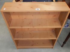 A pine effect bookcase