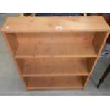 A pine effect bookcase