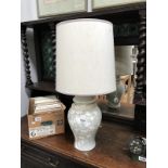 A table lamp with oriental leaf design