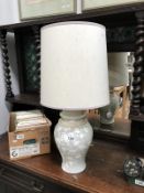 A table lamp with oriental leaf design