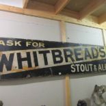 A long 'Whitbread' enamel sign.