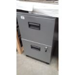 A 2 drawer filing cabinet with key