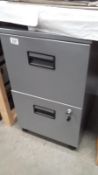 A 2 drawer filing cabinet with key