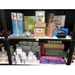 2 shelves of office stationary items including mechanical pencils, screen cleaners etc.