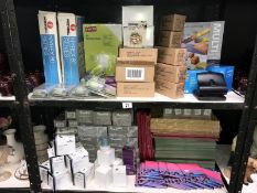 2 shelves of office stationary items including mechanical pencils, screen cleaners etc.