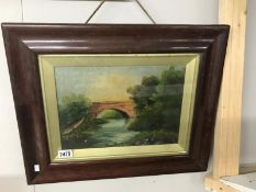 A framed and glazed oil painting of bridge over river,