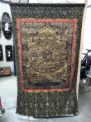 A silk tapestry wall hanging with oriental depictions