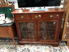 A modern mahogany glazed display cabinet