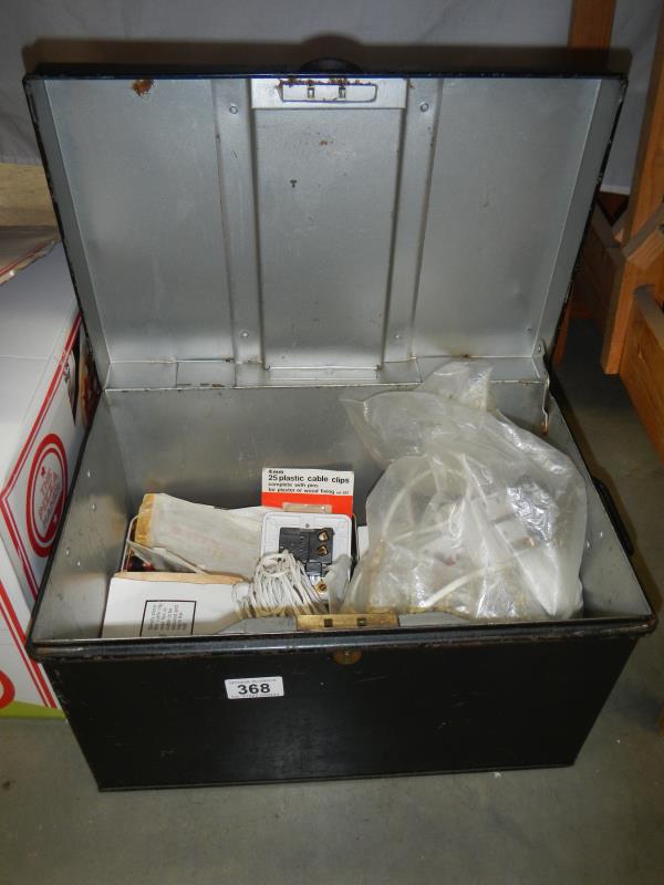 A vintage metal deed box and contents of electrical fittings