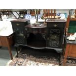 An Edwardian mahogany sideboard