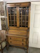 A 1930's oak bureau bookcase