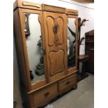 An Edwardian pine wardrobe