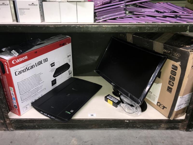 A Canon scanner and an Acer monitor