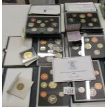 A quantity of UK coin sets etc.