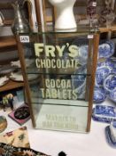 A glass display cabinet with painted advert Fry's Chocolate Cocoa Tablets, Makers to H.