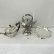 A silver plate kettle on stand, teapot and cake basket.