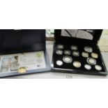 A cased Royal Mint silver proof coin set and a cased Queen Elizabeth II £5 coin.