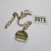 A ladies 9ct gold chain with fob (chain approximately 3 grams).