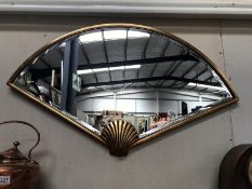 A large Art Deco style fan shaped bevel edge mirror