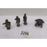 A frog place card holder and 3 metal figures.