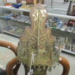 A Victorian Gothic brass church wall fitting featuring canopy (possibly for candle.