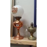 A copper oil lamp and brass oil lamp