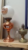 A copper oil lamp and brass oil lamp