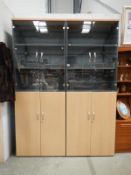 A pair of glazed top showroom display cabinets