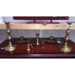 A pair of brass candlesticks and 3 brass chamber sticks