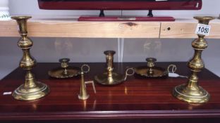 A pair of brass candlesticks and 3 brass chamber sticks
