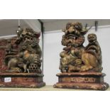 A pair of carved wood 19th century Dogs of Foo (some age cracks but otherwise good),