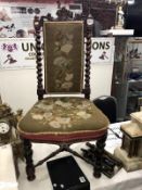 A hall chair with tapestry seat and back