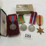 A boxed Imperial Service medal for Joseph Frederick Sardeson and other medals including Africa star