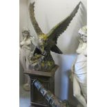 A garden statue of an eagle in flight on plinth, approximately 76" tall in total.