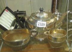 A 3 piece silver plate tea set and other silver plate.